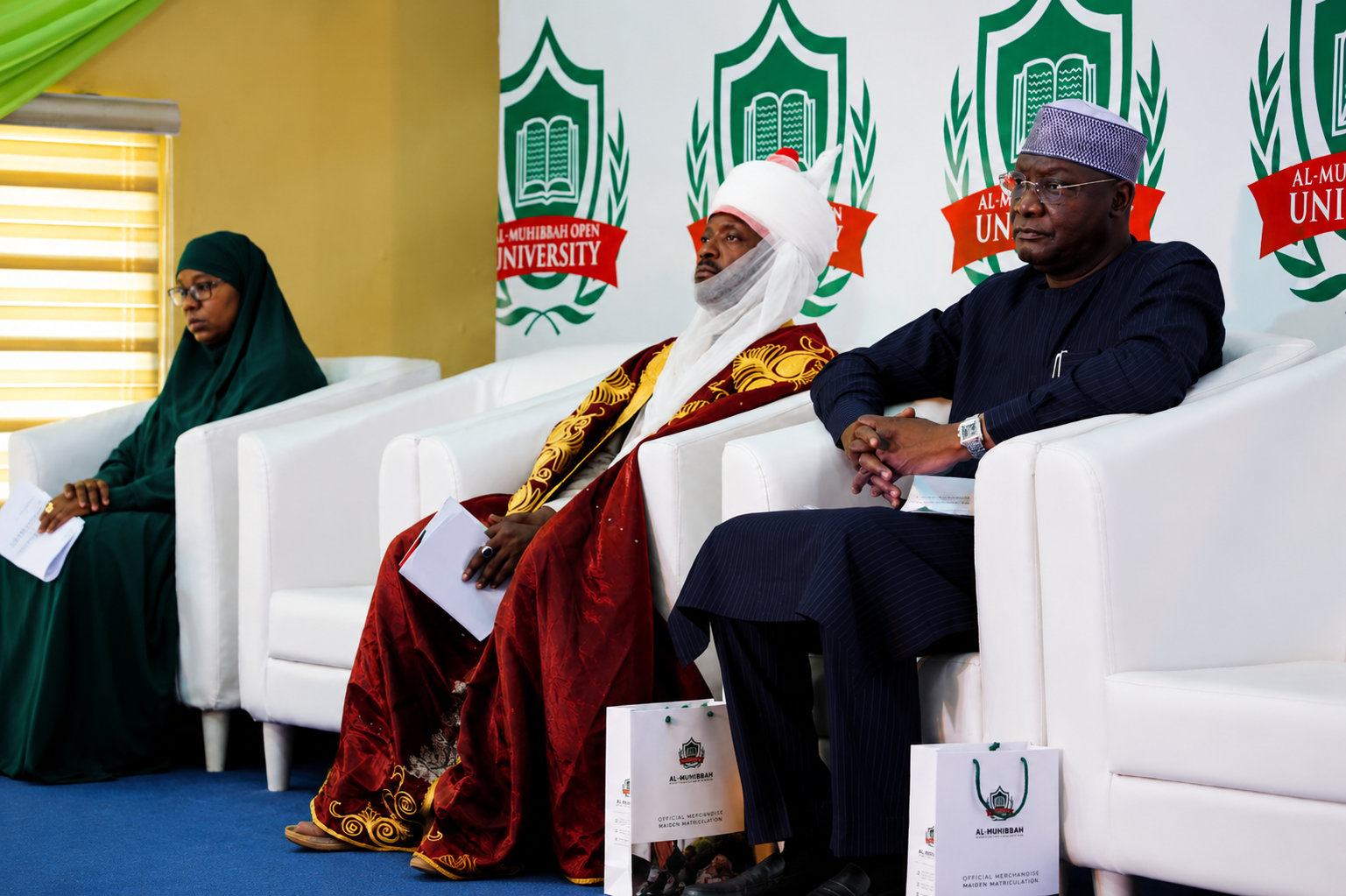 Al-Muhibbah Open University event with distinguished guests on stage.