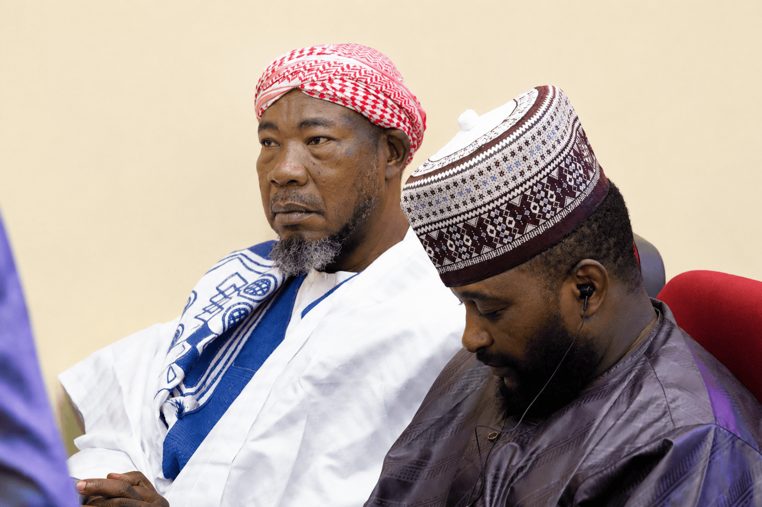 Two men in traditional attire attending a formal event at Al-Muhibbah Open University.